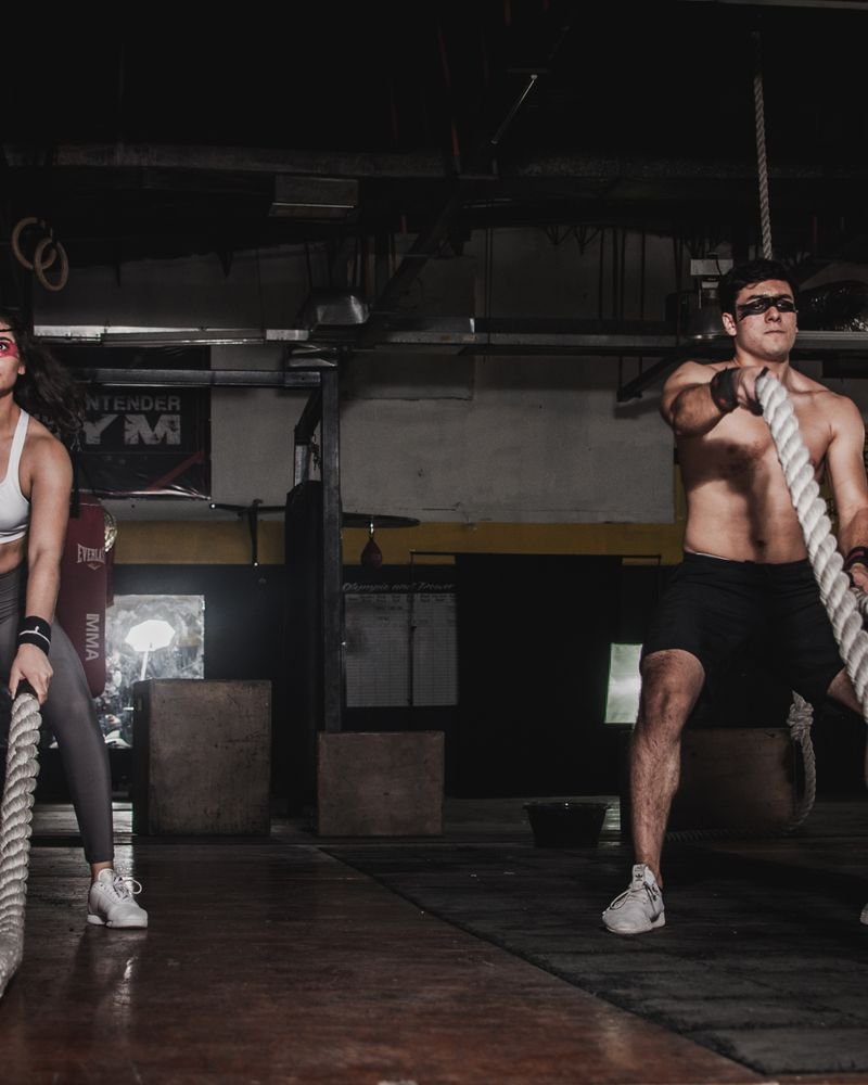 Athlete training with dumbbells in a home gym